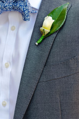 Man in suit with flower buttonhole, close up view
