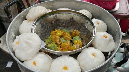 Siopao or steamed bun stuffed with pork, chicken, or beef is a popular street food in Thailand and other countries in Southeast Asia.