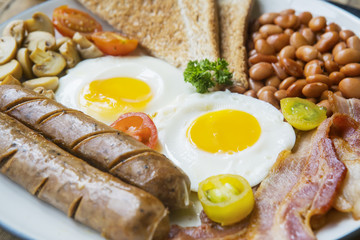 Fried bacon with sausage on the plate