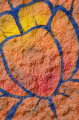 Fragment of graffiti drawings. The old wall decorated with paint stains in the style of street art...