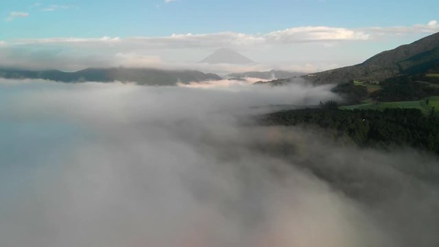 Flying above the clouds at lake Ashi and looking at mount Fuji, Hakone, Japan