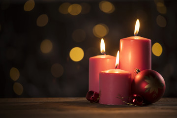 Red candles and Christmas ball ornament