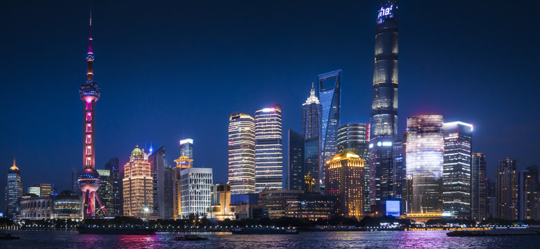 Shanghai, China :Nightscape of Lujiazui skyline as seen from the Bund, across the Huangpu River, with the Shanghai Tower.