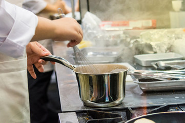 chef cooking, Chef preparing food, meal, in the kitchen, Chef decorating dish, closeup, .chef at work.
