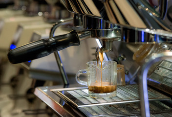 Barista working in a coffee shop, Close up of barista presses ground coffee using tamper, Barista Make Coffee Portafilter Concept