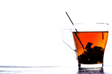 tea in a transparent mug on a white background