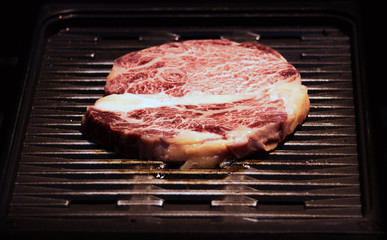 Grilled wagyu beef, Raw marble beef steak frying in black grill pan