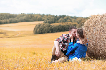 Naklejka na ściany i meble Couple on a walk in the country fields 