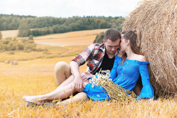 Couple on a walk in the country fields 