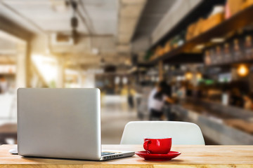 workspace with desktop computer, office supplies, houseplant and coffee cup at office. desk work concept.