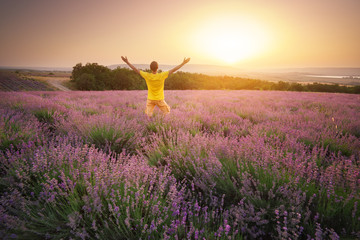 Man in meadow of lavender.
