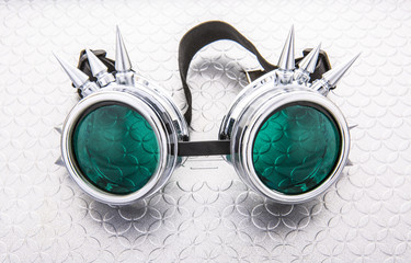 Pair of Steam Punk goggles on a silver background