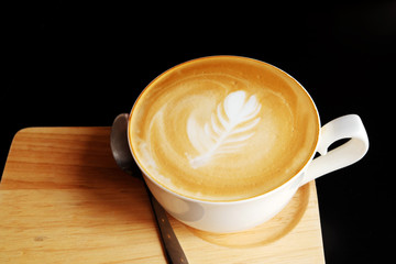 cup of hot coffee on a dark background