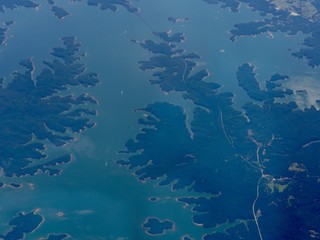 Fototapeta na wymiar Medium close up aerial shot of Lake Lanier, a reservoir in northern Georgia, seen from an airplane window.