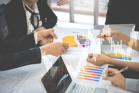 Business people in the meeting to discuss on marketing plan, double exposure of candlestick chart for finance and trading