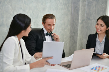 Obraz premium Business Concepts. Businessman is working in office. Business People work happily and relax. The businessmen are serious. Businessmen, they talk and communicate.