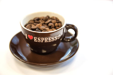 Close up of cup and coffee beans