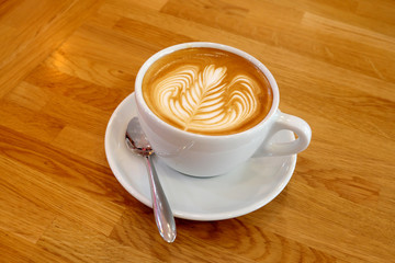 Latte cup Art on a wooden table