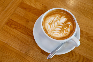 Latte cup Art on a wooden table