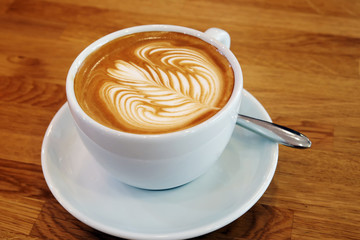 Latte cup Art on a wooden table