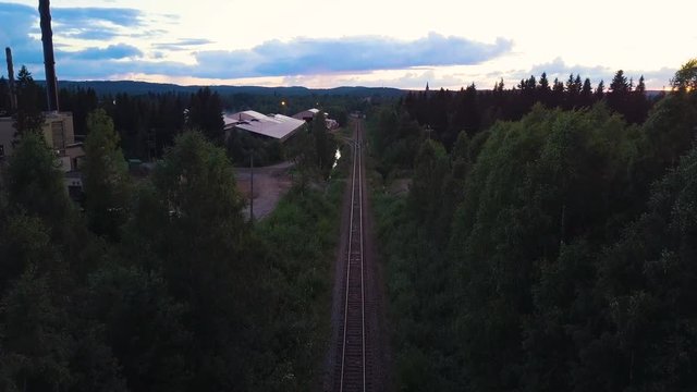 Drone shot of railway track surrounded by trees, Nurmes, Finland