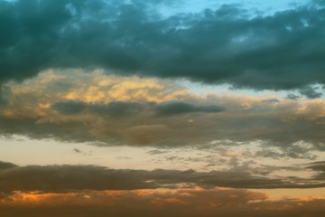 Obraz premium lovely vivid sun colored clouds in the sky for using in design as background.