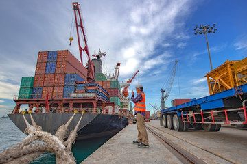 the loading and discharging operation container ship vessel in port takes control by stevedore and foreman in charge, working in port terminal being for logistics and transport services to worldwide. - obrazy, fototapety, plakaty