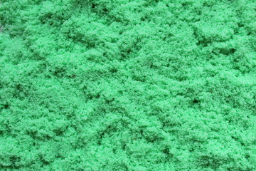 Obraz premium Texture loose sand green color background texture