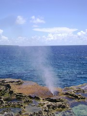  Portrait shot of the famous Blow Hole in the North Field of Tinian, Northern Mariana Islands