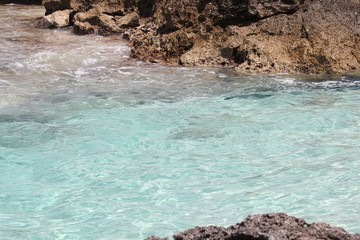 Close up of clear waters at the beach of a tropical island 