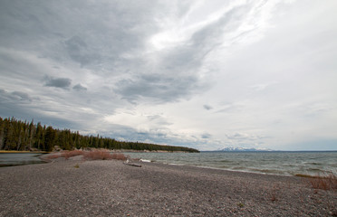 Dark sky over thin peninsula of sand called Hard Road to Follow on the banks of Yellowstone Lake in Yellowstone National Park in Wyoming United States