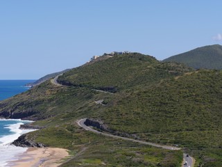 Fototapeta premium Scenic drive along the paved winding roads in the mountainside facing Frigate Bay, St. Kitts, West Indies 