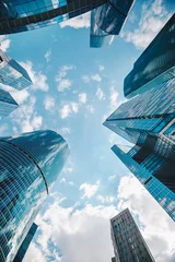 skyscrapers/ High buildings of skyscrapers in blue tones on the sky background © artpodporin