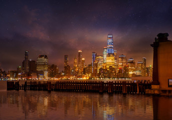  Manhattan skyline with reflections at night,   New York City.