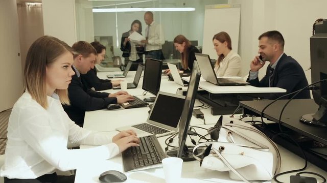Group of successful business people during daily work in modern co-working space
