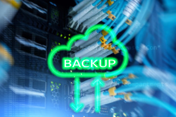 Backup button on modern server room background. Data loss prevention. System recovery.