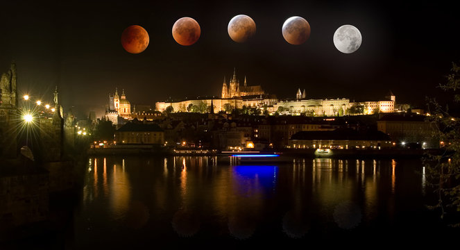 The Prague Castle in Czech Republic with total eclipse of moon