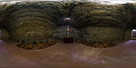 Full seamless 360 degrees angle view panorama inside underground grotto in the church with a...