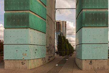 The view through two big pipes to an unfinished apartment tower