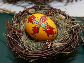 The Easter eggs painted in traditional Bulgarian style on the handmade felt mat. Easter eggs painted with Bulgarian traditional symbols