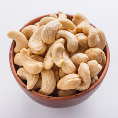 cashew nuts on a white acrylic background