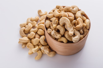 cashew nuts on a white acrylic background