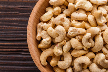 cashew nuts on a rustic wooden background