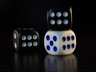 Table gambling with dice and backgammon in the evening with dim light on a dark background