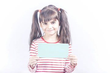 Cute little girl holding a blank advertising banner with copy space