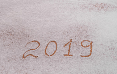 Figures 2019 are written in the snow.