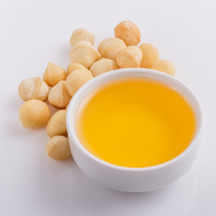 delicious macadamia nuts on a white acrylic background