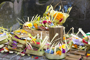 Hindu Balinese offerings to the gods consisting of woven baskets containing food and flowers.