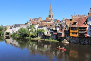 People kayaking on river Creuse in historic city of Argenton sur Creuse called the Venice of Berry, Berry region - Indre, France - obrazy, fototapety, plakaty