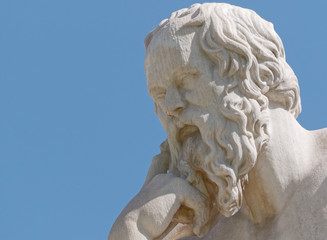 Socrates  the ancient greek philosopher portrait on blue sky background, detail of marble statue in...